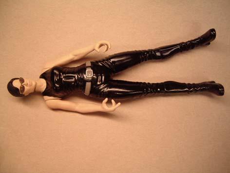 The right leg was cut at the knee and bent into the correct angle. The right arm was straightened by cutting at the elbow and inserting some styrene rod.