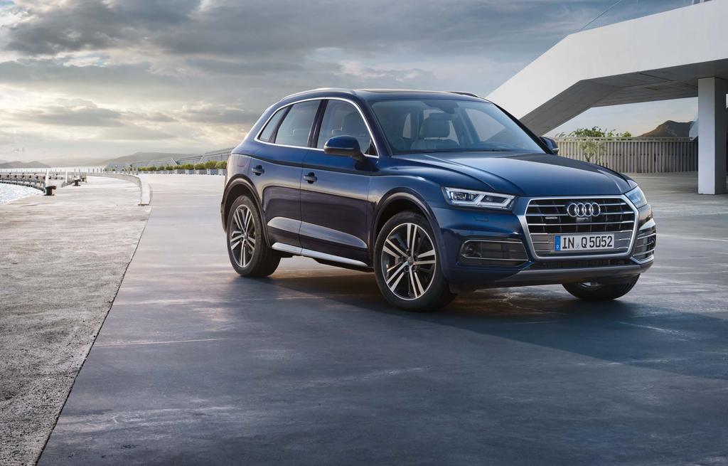 The all-ew Audi Q5 ad SQ5. A redesiged exterior. A more powerful face. A iterior with more headroom ad a eve greater luggage capacity.