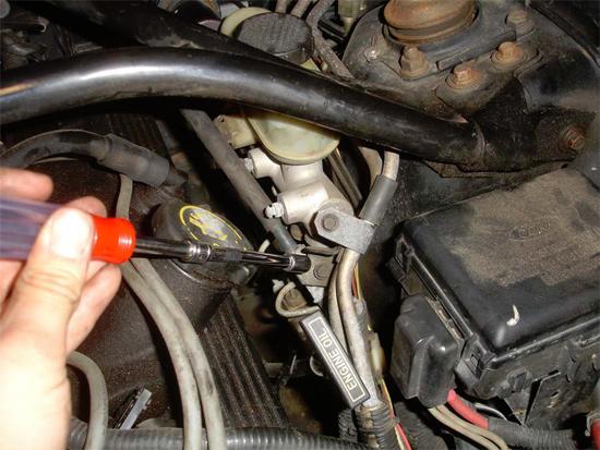 8. The last bolt is located up top by the oil filler cap, and below the brakes master cylinder.