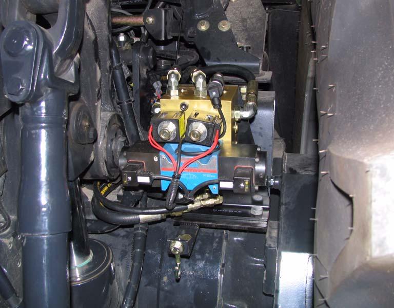 Mount the hydraulic valve bracket vertical