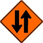 Indicates that there is a flagger ahead directing the flow of traffic through the work zone.