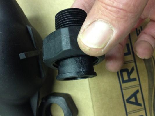 Install the rubber washer gasket in the connecting nut and