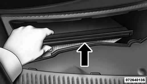 MAINTAINING YOUR VEHICLE 411 7 Filter Access Cover 3. Remove the used filter. 4. Install the new filter with arrows pointing in the direction of airflow, which is toward the rear of the vehicle (text and arrows on the filter will indicate this).