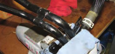 83. Once the coolant pipes have been separated, reinstall the smaller diameter of the two by gently sliding it onto the nipple in the engine valley and
