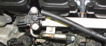 108. Install the 1/4 vacuum hose attached to the rear of the manifold onto the fuel