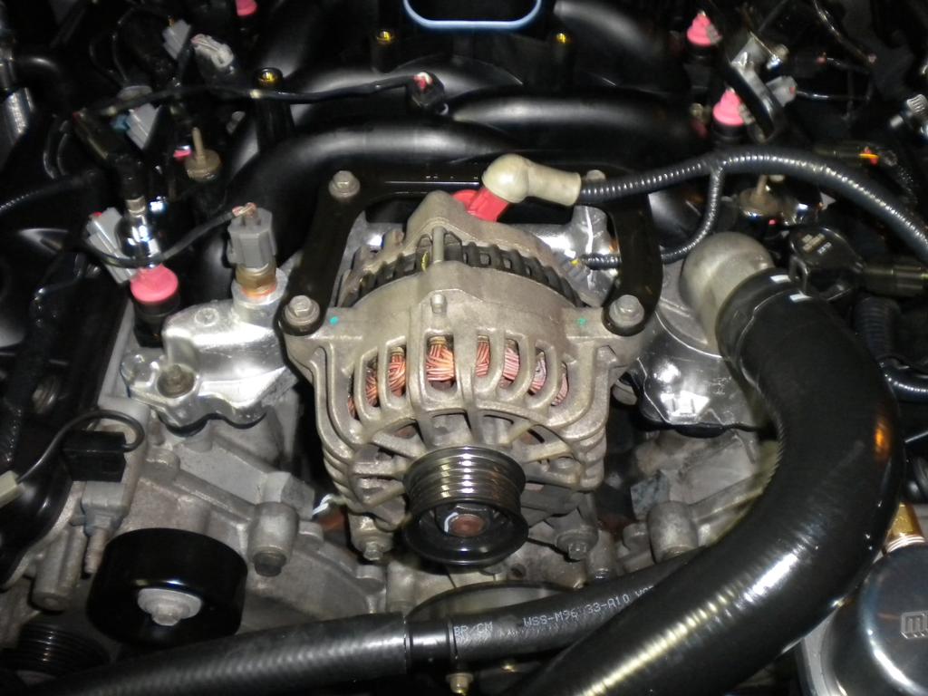 11. Reconnect the heater hose to the back of the intake manifold. 12. Now set the upper intake plenum assembly on top of the intake manifold.