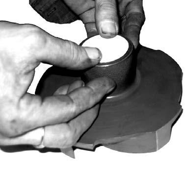 The seal half is pressed into the hub of the impeller by using both thumbs (shown in photo at left).