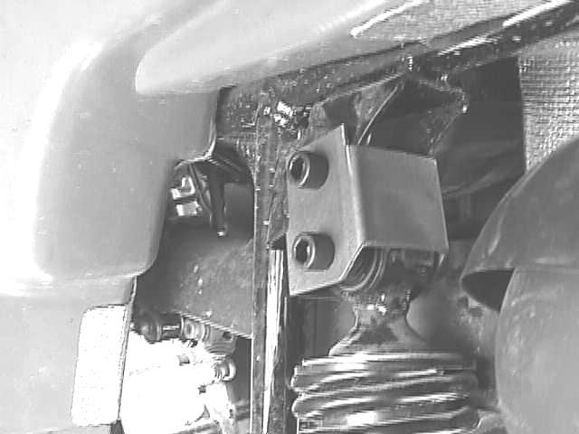 The angle of the rear drive shaft has been changed slightly so that the two halves of the yoke holding the u-joint, immediately behind the engine, touch as the drive shaft rotates.