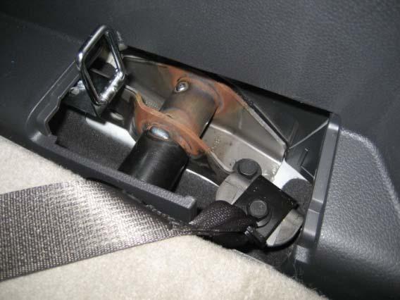 (15mm socket) Remove third seat forward brackets.