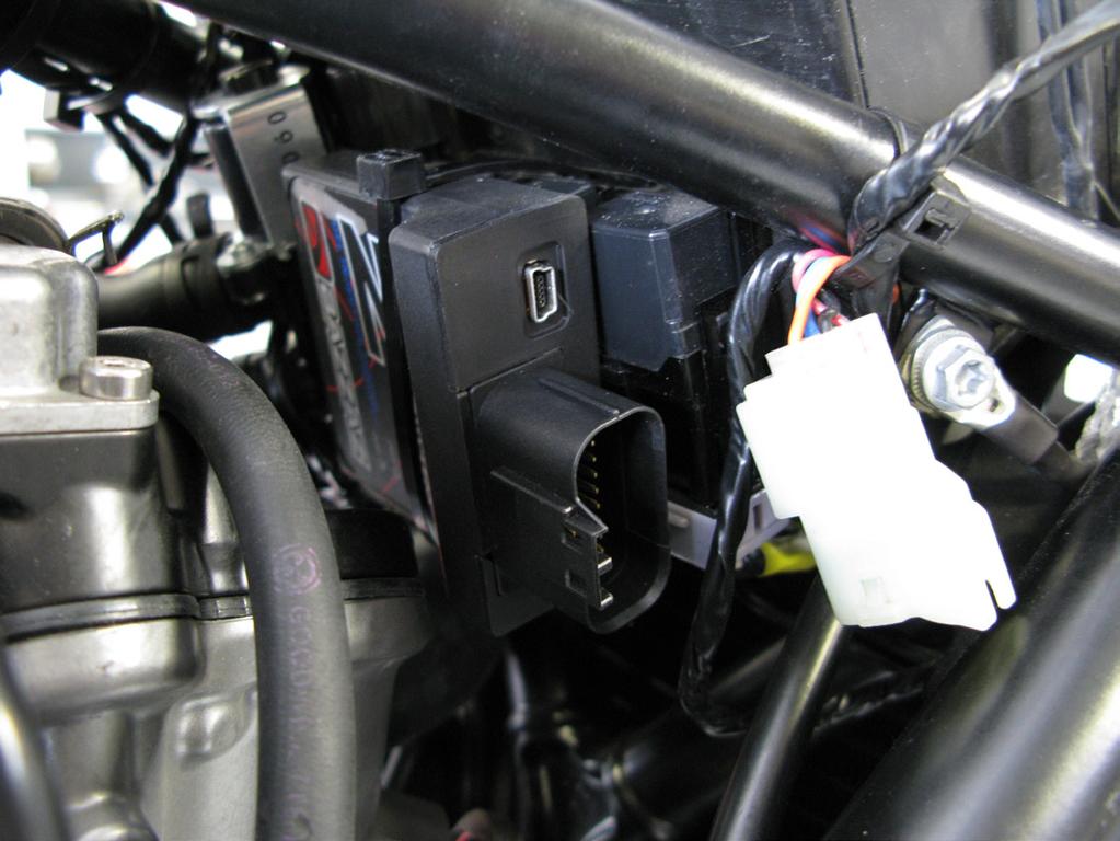 3. Use the supplied large cable tie to secure the control unit to the factory harness relay mount behind the battery (photos 3 & 4).