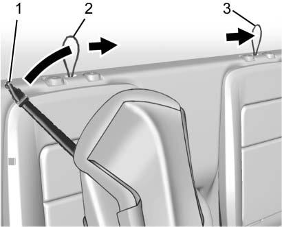 86 Seats and Restraints 2. Press the button for the passenger side headrest at the top of the seatback and pull up. 3.