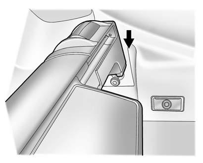 Storage 103 Install the Cargo Cover 1. Hold the cartridge so that the pull-out shade faces the rear of the vehicle. 2.