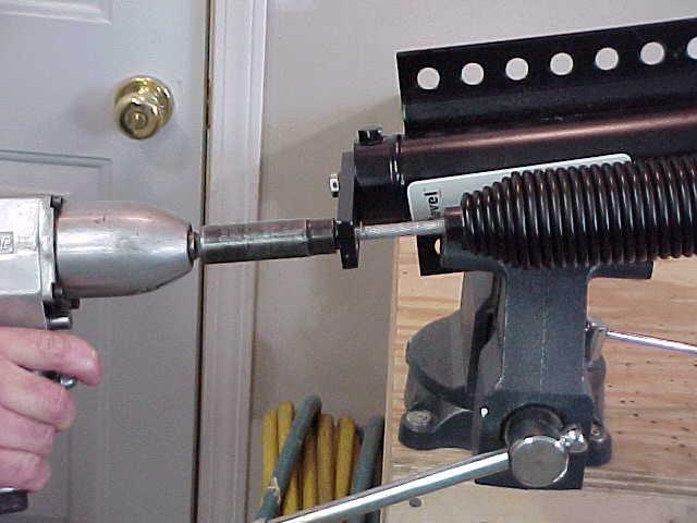 STEP 19 - FINISH THREADING THE SPRING BOLT UNTIL TIGHT. INSTALL JACK ON COACH AND TEST.