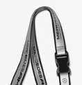 In metal case with snap hook. size approx. 7 x 2 cm. B6 799 5137 7 8 8 dtm lanyard. silver-coloured/black. Polyester. safety clasp at back of neck. B6 799 5154 9 MoToRSpoRT Flag. silver-coloured. Polyester. Black wooden pole for waving.