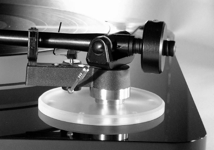 7. Turn the tonearm into the final position where the tonearm is almost parallel to the right hand edge of the chassis.