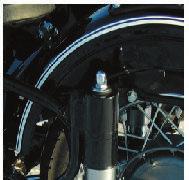 SPRING LOADED HYDRAULIC SHOCK ABSORBER The suspension features cam-type adjusters used for varying the preload of the supporting springs to suit the load and the road conditions.