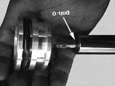 Place a new o-ring on the shoulder of the shaft and install the piston to the shaft using #272 Loctite
