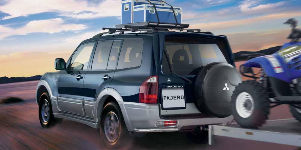 TRANSPORT & LEISURE Pajero shown with roof carrier, luggage carrier, sportive spoiler, spare wheel cover, rear bumper lamp- and corner protector, single tube and alloy wheels.