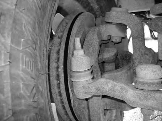 39. Disconnect the tie rod end from one of the steering knuckles and swing the whole assembly out of the way. (Fig 25) FIG. 25 40. Disconnect the trackbar from the axle. Retain nut tab. 41.