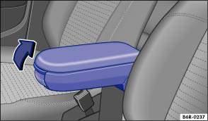 Fig. 46 Front centre armrest To lift, pull the centre armrest up gradually in the direction of the arrow Fig. 46. To lower, pull the centre armrest all the way up. Then lower the centre armrest.