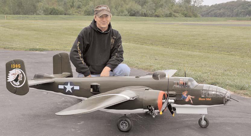 CAROLYN SCHLUETER PHOTO Jeff Muhs with his Show Me B-25. It depicts the Commemorative Air Force B-25 kept at Smartt Field, in St. Charles County.