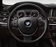 BMW Individual leather steering wheel with Piano fi nish Black wood ring inlay.