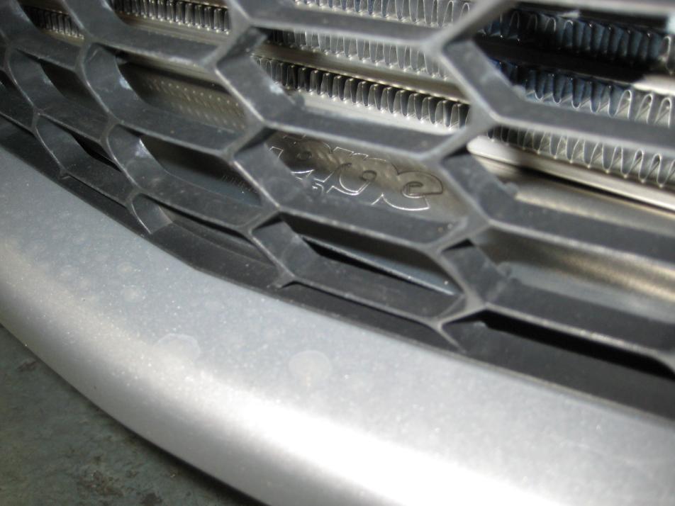 Replace the bumper on the front of the car noting that the Forge intercooler has a lower air guide that sits inside the grille opening and may