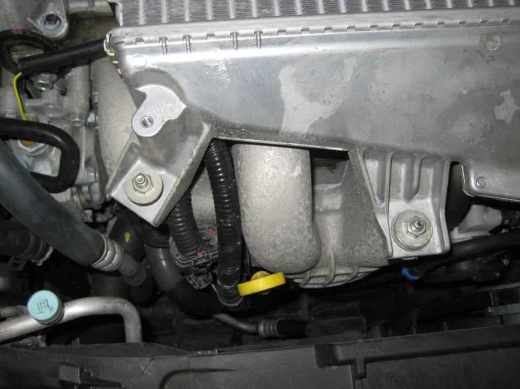 5. Undo the two 12mm nuts at the front holding the intercooler to the mounting bracket and the one 12mm nut at the