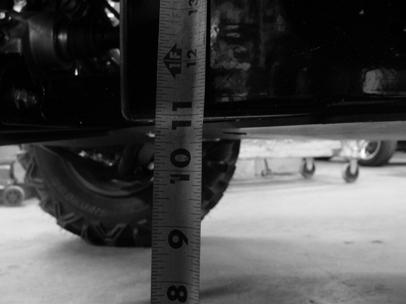 Use a tape measure to measure the height of the lowest point on the chassis rail or skid plate in the front and rear (as shown below). 11.