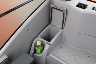 The cab is pressurized to keep out dust. Noise and vibrations are kept to a minimum due to the elastic mounts, filled with silicone oil, the cab rests on.