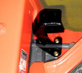 Take the left rear mounting bracket and slide it over the lower 2-Post ROPS mount socket in the fender.
