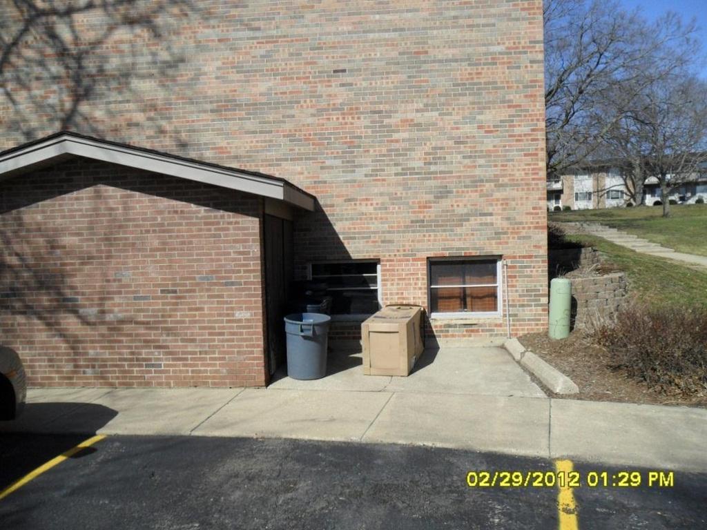 Storage illustration: Trash-can storage areas, such as this one at an Eisenhower Street complex, will not accommodate a multitude of wheeled carts. Storage A major problem is storage.