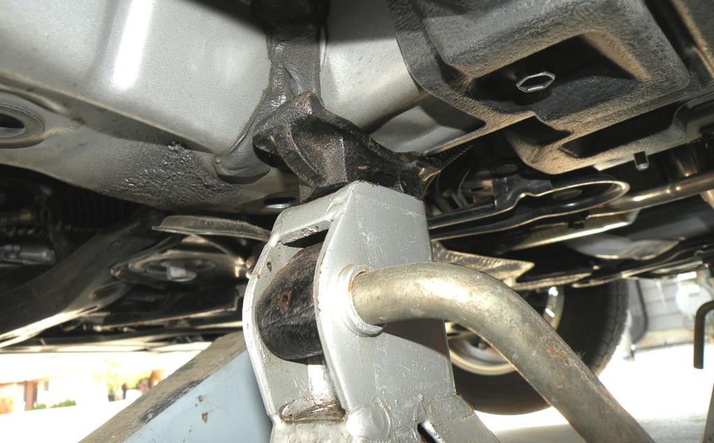 Stand placement is similar for the other side, directly beneath the vehicle frame. The two stands will be providing primary support, not the jack.