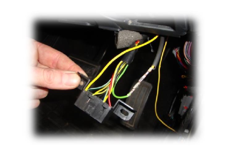 9. Locate the wire of the coil spring kit harness that terminates with a small socket.