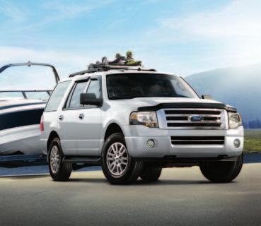 Expedition+EL Specifications Standard Features XLT in Oxford White customized with smoked hood and side window deflectors, flat splash guards, roof-mounted ski carrier by THULE, and trailer towing