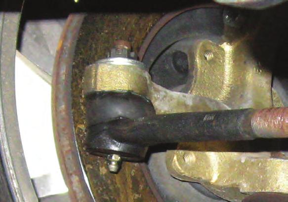 the outer tie rod into the spindle arms and tighten