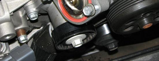Use a 10mm socket to remove the two bolts securing each ignition coil, then pull them out.