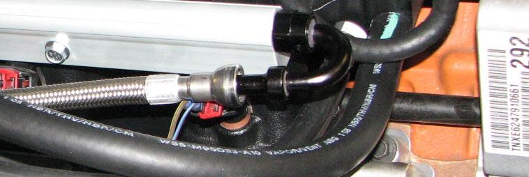 Install the supplied EVAP hose between the solenoid and the smaller, rear fitting on the passenger side of the air inlet.