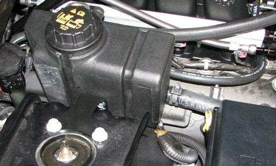 If the stock ETC harness is on the passenger side, attach the supplied ETC extension harness to the ETC connector on the main engine wiring harness and route