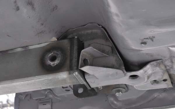 25. The cap at the end of the frame rail where is meets the bumper panel has only been tack welded on.