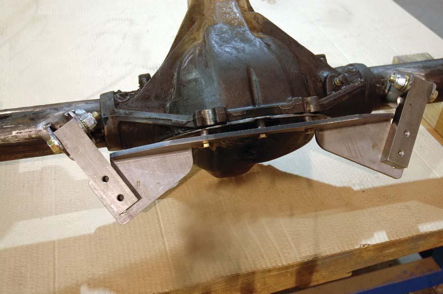 A Chassisworks weld fi xture must be used to accurately position and weld the upper brackets to axle tube. The 10-bolt fi xture is shown bolted to the rear of the housing.