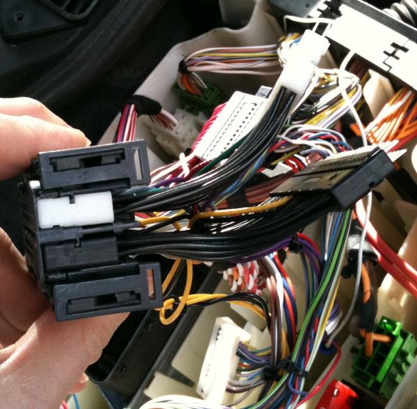 . Reinstall the small slider and reinstall the ECU connectors to the ECU.