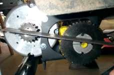 two sprockets bring them into alignment (picture 14). Tighten both setscrews on the two sprockets and add the chain.