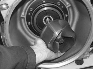 5.4.2 Using an impact wrench, loosen the impeller (c) by turning the nut (molded into impeller casting) counterclockwise. Once loose, pull the impeller from the volute.
