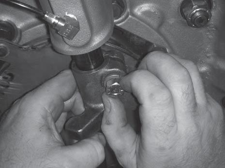 cap screw and lock washer by hand. Service Procedure 3.