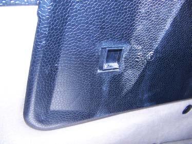 (Pull the spring-loaded latch of the tail light assembly, swing the assembly open, and