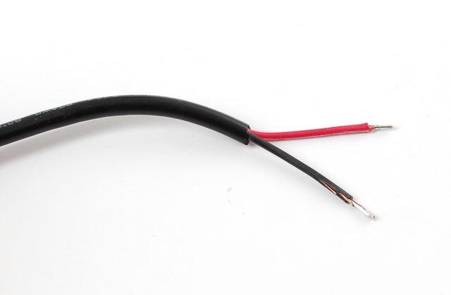 Place a big piece of heatshrink onto the cable, and then two shorter and