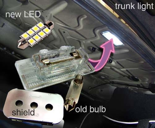 Trunk - Step 1 There are two trunk lights: one in the body panel above the trunk area, and another in the trunk lid. Pry down at the notched end of the light inside the trunk.