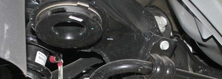 Figure 2: Rear sway bar close up with OEM link Remove the two nuts (one on each side) at