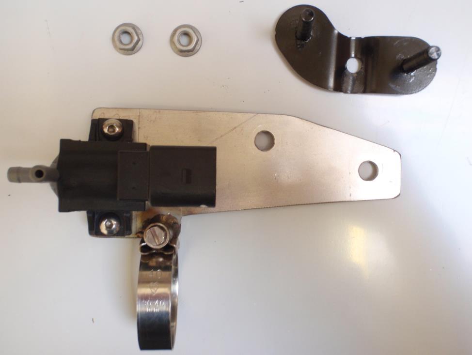 Locate the supplied Forge mounting bracket and mount the solenoid as shown below using the two M5 screws provided.